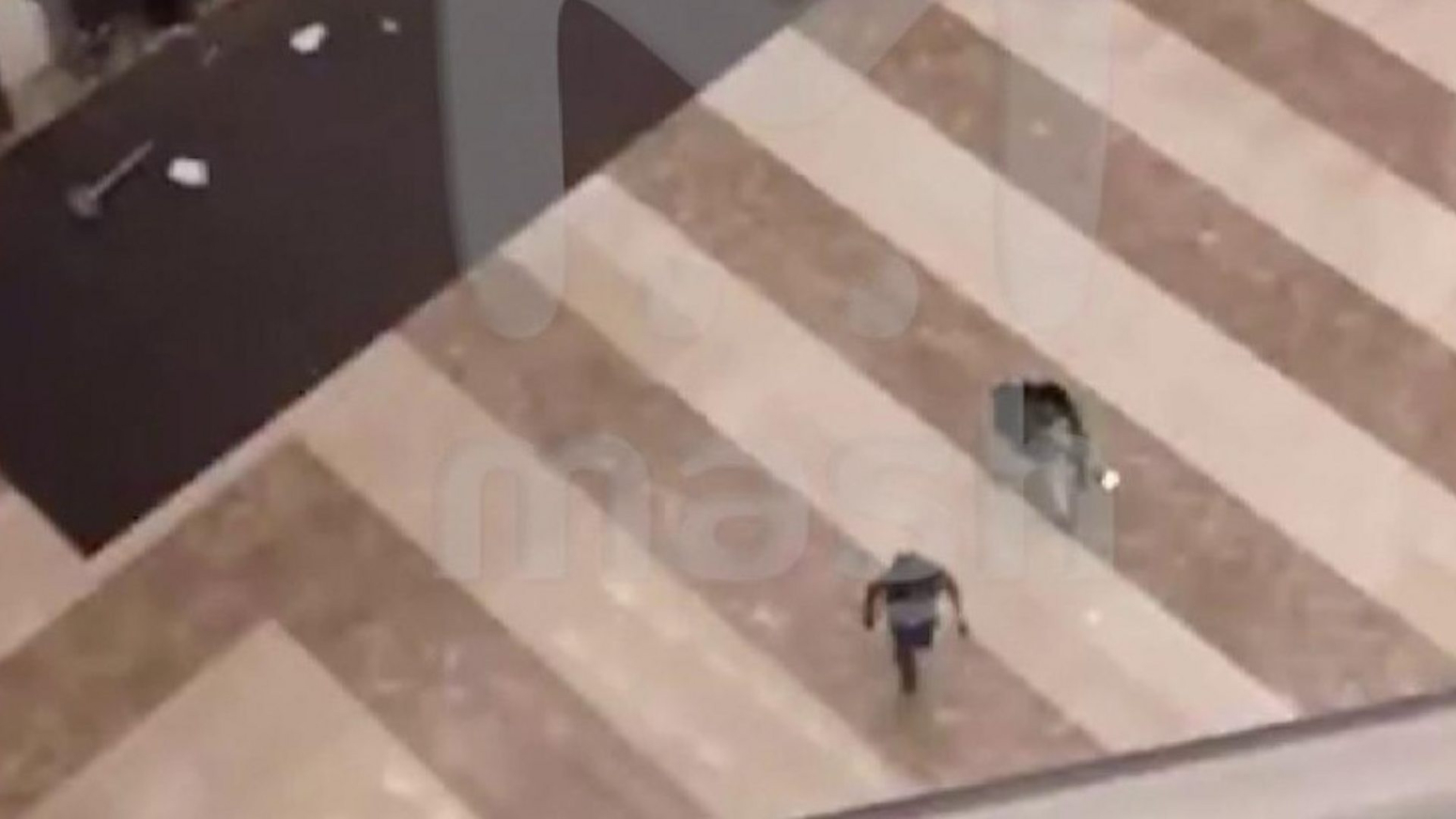 Video shows gunmen in concert hall lobby