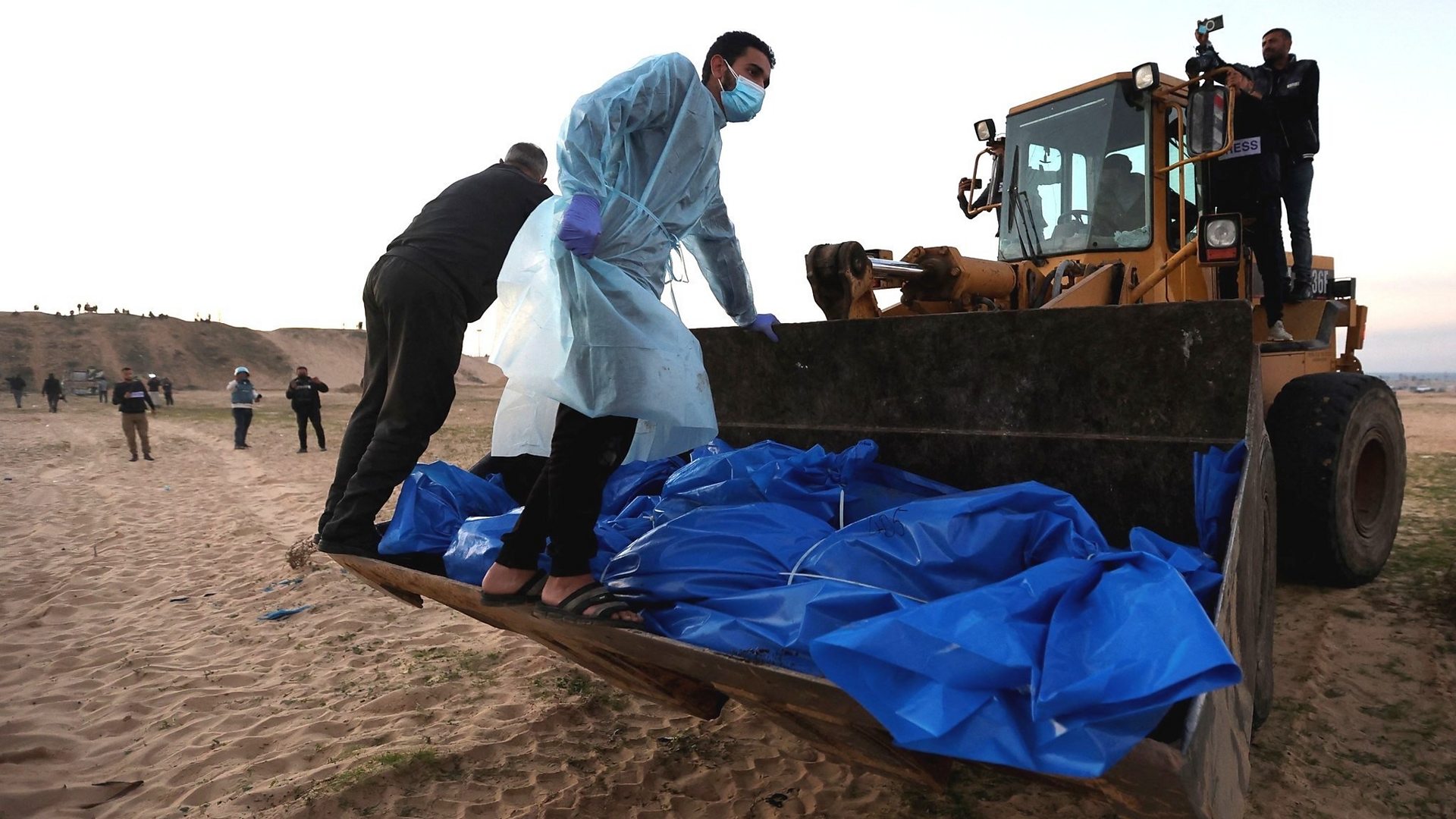 Drone shots show Palestinians buried in mass grave